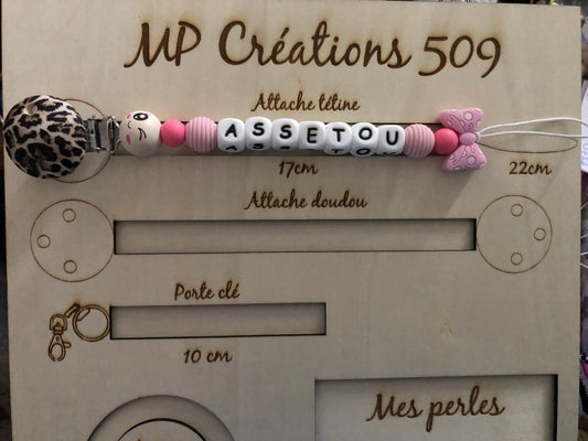 Attache tétine noeud rose