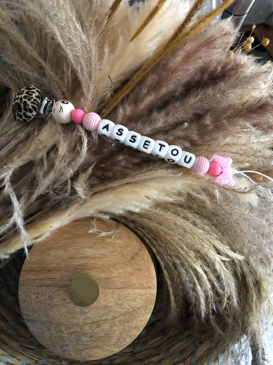 Attache tétine noeud rose